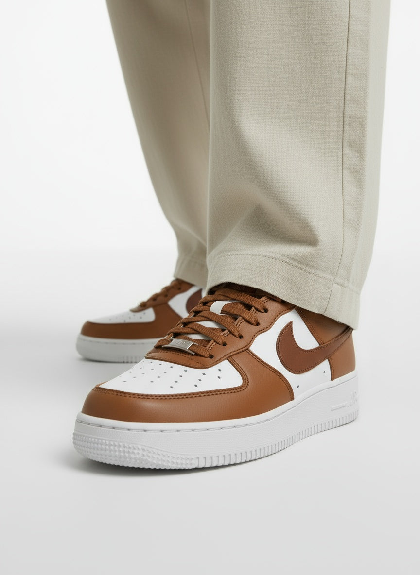 Close-up lower legs and shoes of the model wearing Nike Wmns Air Force 1 '07 IM6364-200