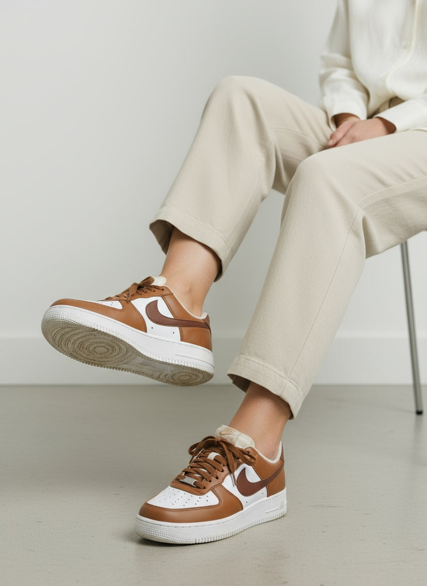 Sitting relaxed pose of the model wearing Nike Wmns Air Force 1 '07 IM6364-200